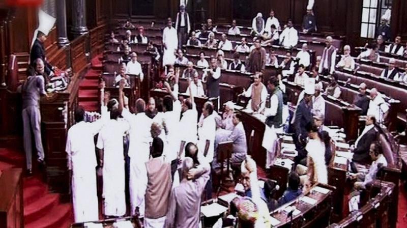 Opposition members protest in the well of Rajya Sabha during the winter session of Parliament in New Delhi. (Photo: PTI) Opposition members protest in the well of Rajya Sabha during the winter session of Parliament in New Delhi. (Photo: PTI)