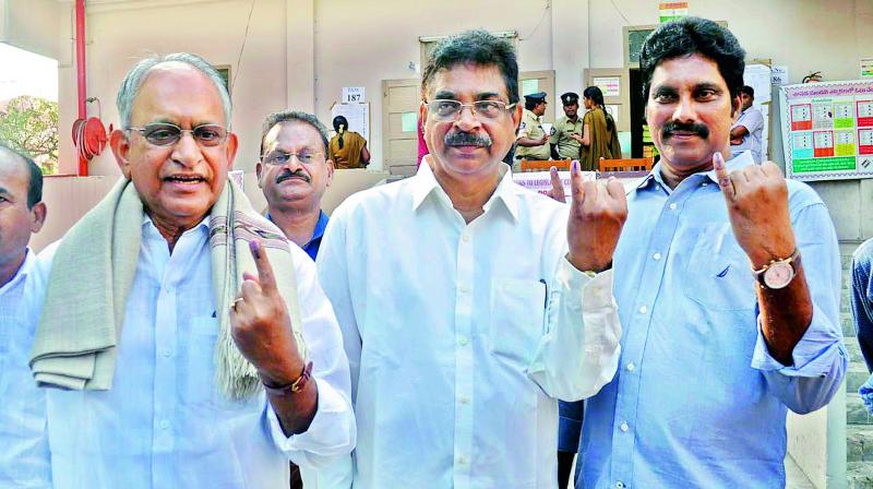 Vizag MP K. Haribabu, MLC M.V.V.S. Murthi display the ink mark on their fingers after casting their vote at the Graduates MLC polls in Visakhapatnam on Thursday. Vizag MP K. Haribabu, MLC M.V.V.S. Murthi display the ink mark on their fingers after casting their vote at the Graduates MLC polls in Visakhapatnam on Thursday.