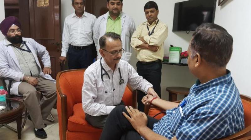 Doctors doing normal Health Check up of SatyendarJain at LG House as he is on Anshan since Tuesday morning. (Photo: Twitter | @ArvindKejriwal ) Doctors doing normal Health Check up of SatyendarJain at LG House as he is on Anshan since Tuesday morning. (Photo: Twitter | @ArvindKejriwal )