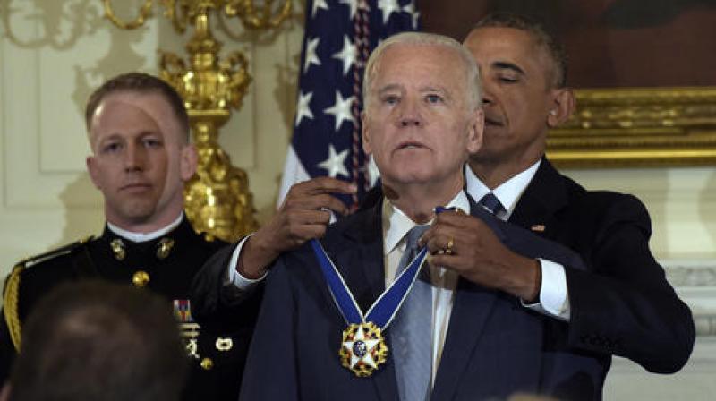 President Barack Obama presents Vice President Joe Biden with the Presidential Medal of Freedom during a ceremony in the State Dining Room of the White House in Washington. (Photo: AP) President Barack Obama presents Vice President Joe Biden with the Presidential Medal of Freedom during a ceremony in the State Dining Room of the White House in Washington. (Photo: AP)