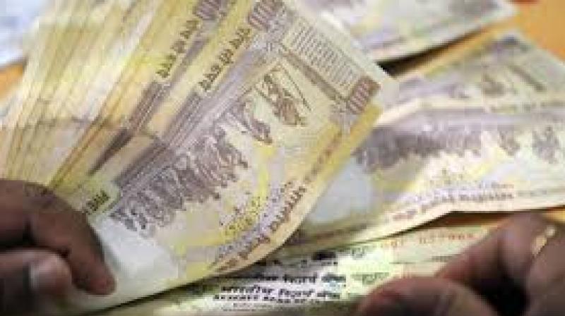 Three people were arrested by the Kothanur police for trying to exchange demonetised currency notes in the city and have seized currency notes of Rs 1.95 crore face value from the accused Three people were arrested by the Kothanur police for trying to exchange demonetised currency notes in the city and have seized currency notes of Rs 1.95 crore face value from the accused
