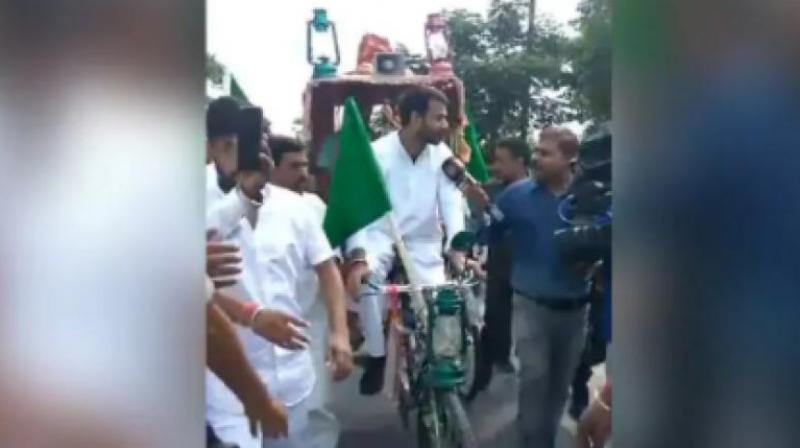 Tej Pratap Yadav had driven the cycle rickshaw for some distance before stating 'everybody should drive a rickshaw. It would come in handy at a time when fuel prices are soaring. The physical exertion involved would also bring health benefits'. (Photo: Twitter | @TejPratap14) Tej Pratap Yadav had driven the cycle rickshaw for some distance before stating 'everybody should drive a rickshaw. It would come in handy at a time when fuel prices are soaring. The physical exertion involved would also bring health benefits'. (Photo: Twitter | @TejPratap14)