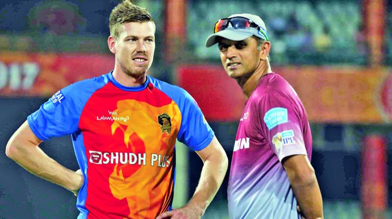 Gujarat’s James Faulkner (left) and Delhi coach Rahul Dravid (Photo: BCCI) Gujarat’s James Faulkner (left) and Delhi coach Rahul Dravid (Photo: BCCI)