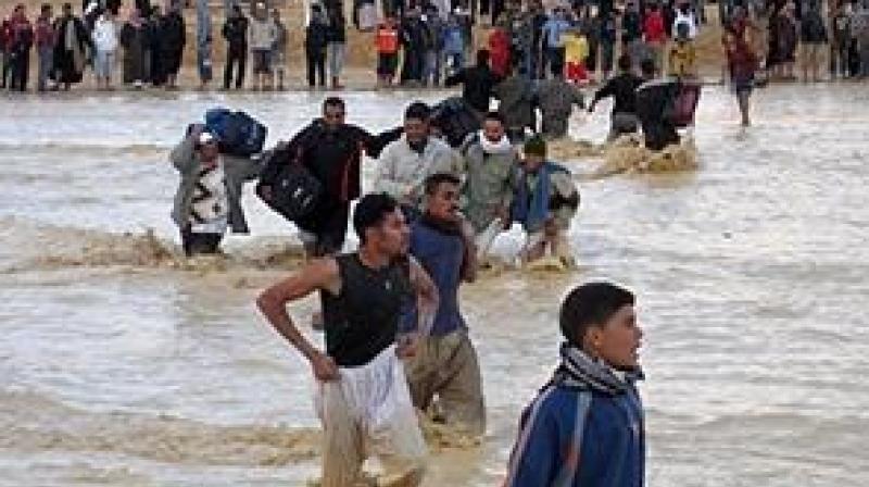 Pictures showed vehicles submerged and citizens making their way through muddy streets and knee-deep water. (Photo: Representational Image/AFP) Pictures showed vehicles submerged and citizens making their way through muddy streets and knee-deep water. (Photo: Representational Image/AFP)