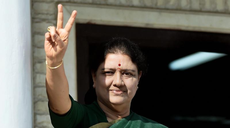 Sasikala flashes a victory sign after attending the party MLA's meeting in which she was elected as a AIADMK Legislative party leader. (Photo: PTI) Sasikala flashes a victory sign after attending the party MLA's meeting in which she was elected as a AIADMK Legislative party leader. (Photo: PTI)