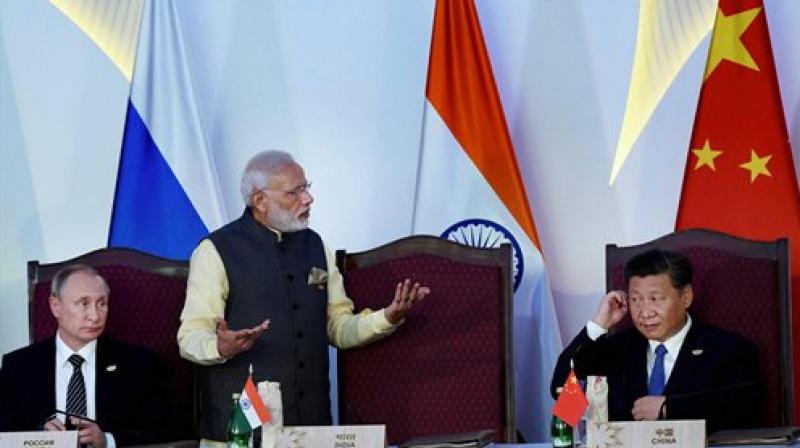 Prime Minister Narendra Modi, Russian President Vladimir Putin and Chinese President Xi Jinping after the press statement during BRICS Summit in Benaulim, Goa. (Photo: PTI) Prime Minister Narendra Modi, Russian President Vladimir Putin and Chinese President Xi Jinping after the press statement during BRICS Summit in Benaulim, Goa. (Photo: PTI)