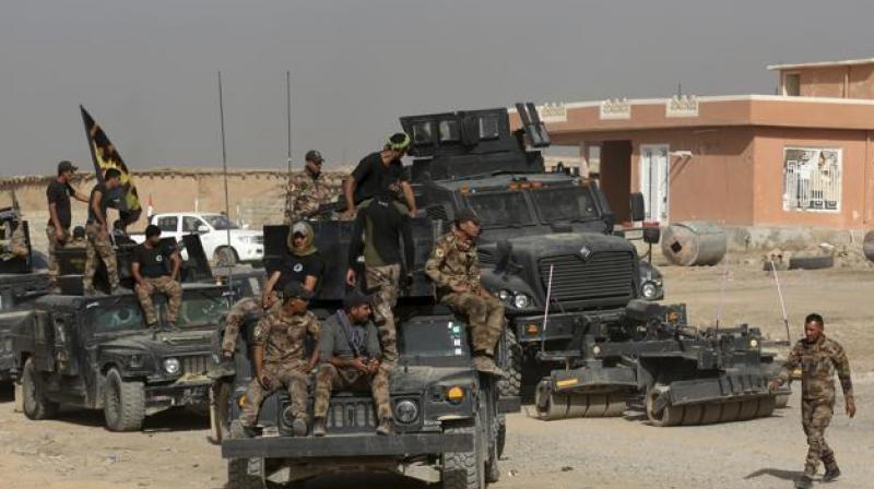 Iraq's elite counterterrorism forces gather ahead of an operation to retake the Islamic State-held city of Mosul on Saturday. (Photo: AP) Iraq's elite counterterrorism forces gather ahead of an operation to retake the Islamic State-held city of Mosul on Saturday. (Photo: AP)