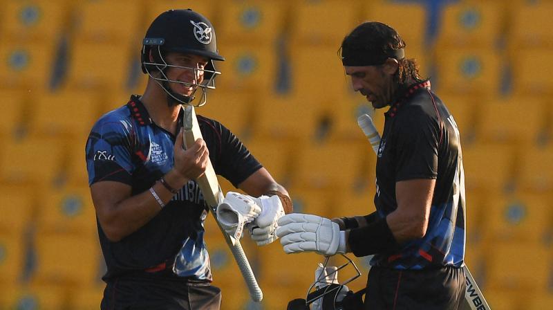 Namibia's David Wiese (R) and JJ Smit talk after their win at the end of the ICC men’s Twenty20 World Cup cricket match between Namibia and Netherlands at the Sheikh Zayed Stadium in Abu Dhabi on Wednesday. (Photo: AFP) Namibia's David Wiese (R) and JJ Smit talk after their win at the end of the ICC men’s Twenty20 World Cup cricket match between Namibia and Netherlands at the Sheikh Zayed Stadium in Abu Dhabi on Wednesday. (Photo: AFP)