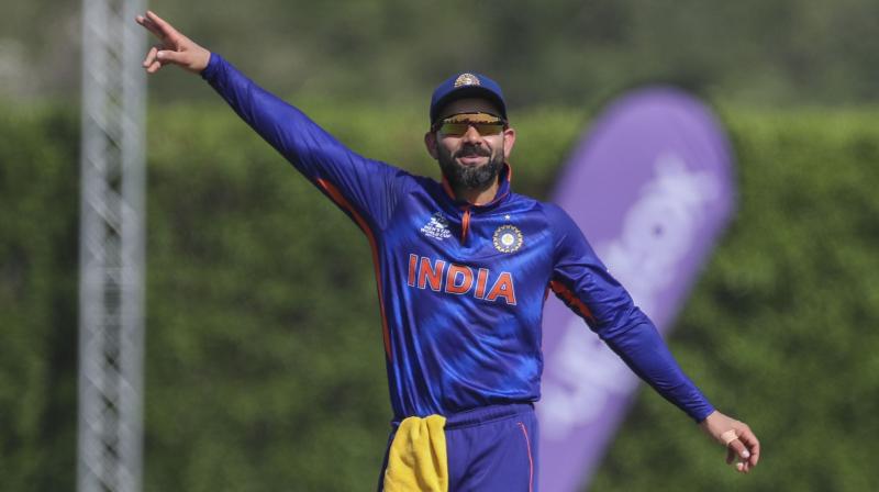 Indias captain Virat Kohli gestures to his teammates during the Cricket Twenty20 World Cup warm-up match between India and Australia in Dubai on Wednesday. (AP Photo)