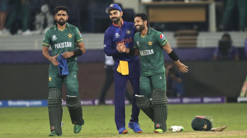 Indian cricket captain Virat Kohli congratulates Pakistans Mohammad Rizwan at the end of the Cricket Twenty20 World Cup match between India and Pakistan in Dubai on Sunday. (AP Photo)