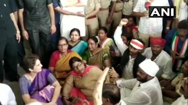 'Just want to go and meet families of victims, I even said will take only 4 people with me.Yet administration is not letting us go there.They should tell us why we are being stopped. We will continue to sit here peacefully,' Priyanka said. (Photo: Twitter IANI) 'Just want to go and meet families of victims, I even said will take only 4 people with me.Yet administration is not letting us go there.They should tell us why we are being stopped. We will continue to sit here peacefully,' Priyanka said. (Photo: Twitter IANI)