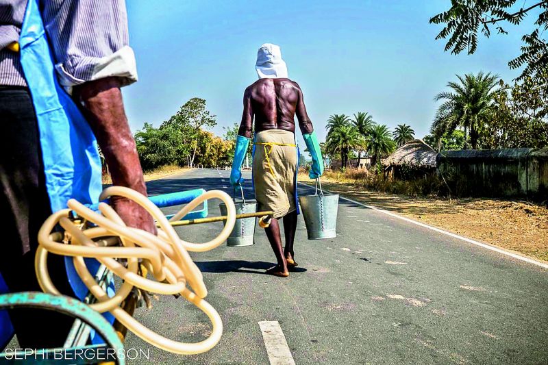 A team get ready to spray insectide in houses against mosquitos as prevention against malaria in the Angul district of Odisha.