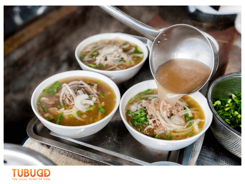 Unlike standard tours, locals can take you to places like a tiny phở stall in a backstreet.