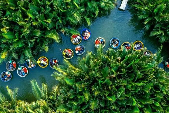 Take a basket boat ride at Bay Mau Coconut Forest