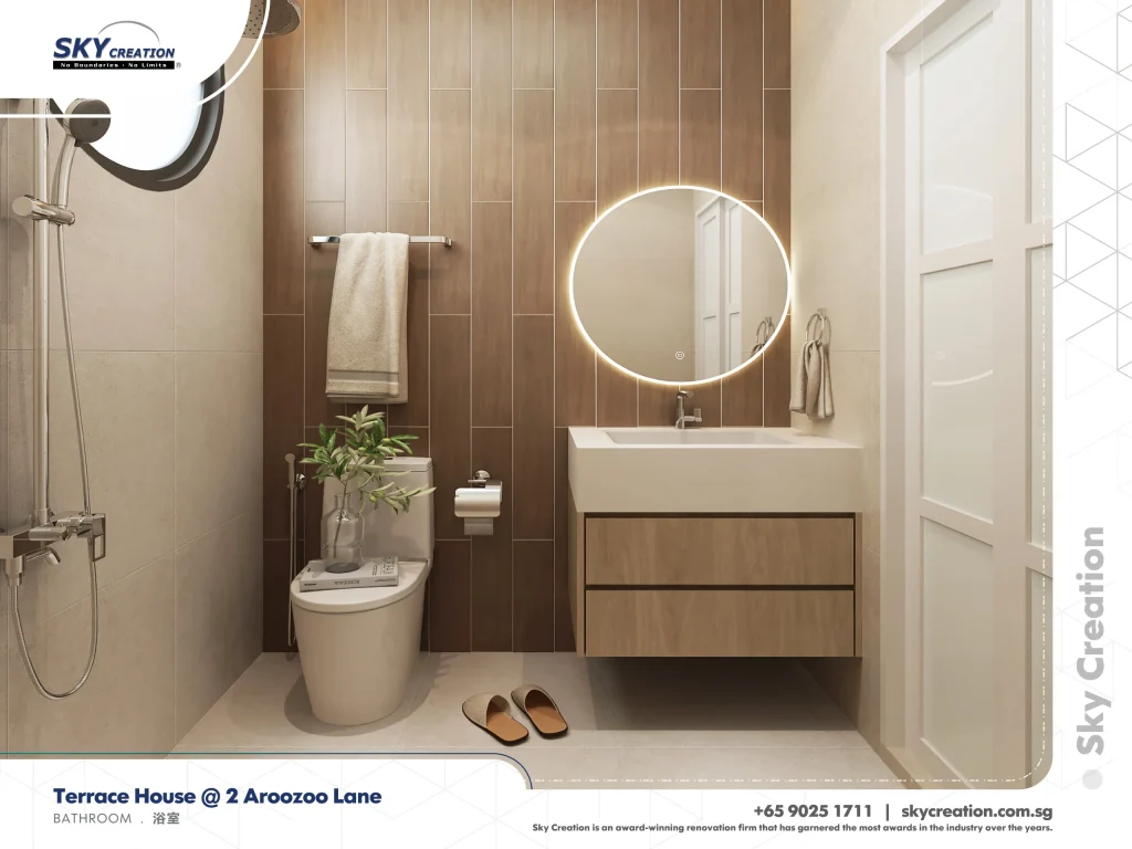 Aroozoo Lane bathroom with a round illuminated mirror against brown vertical tiles