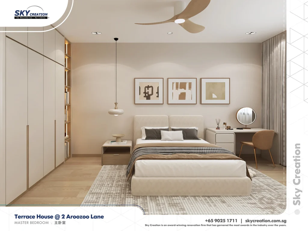Aroozoo Lane bedroom with three framed prints above the bed and a dressing table