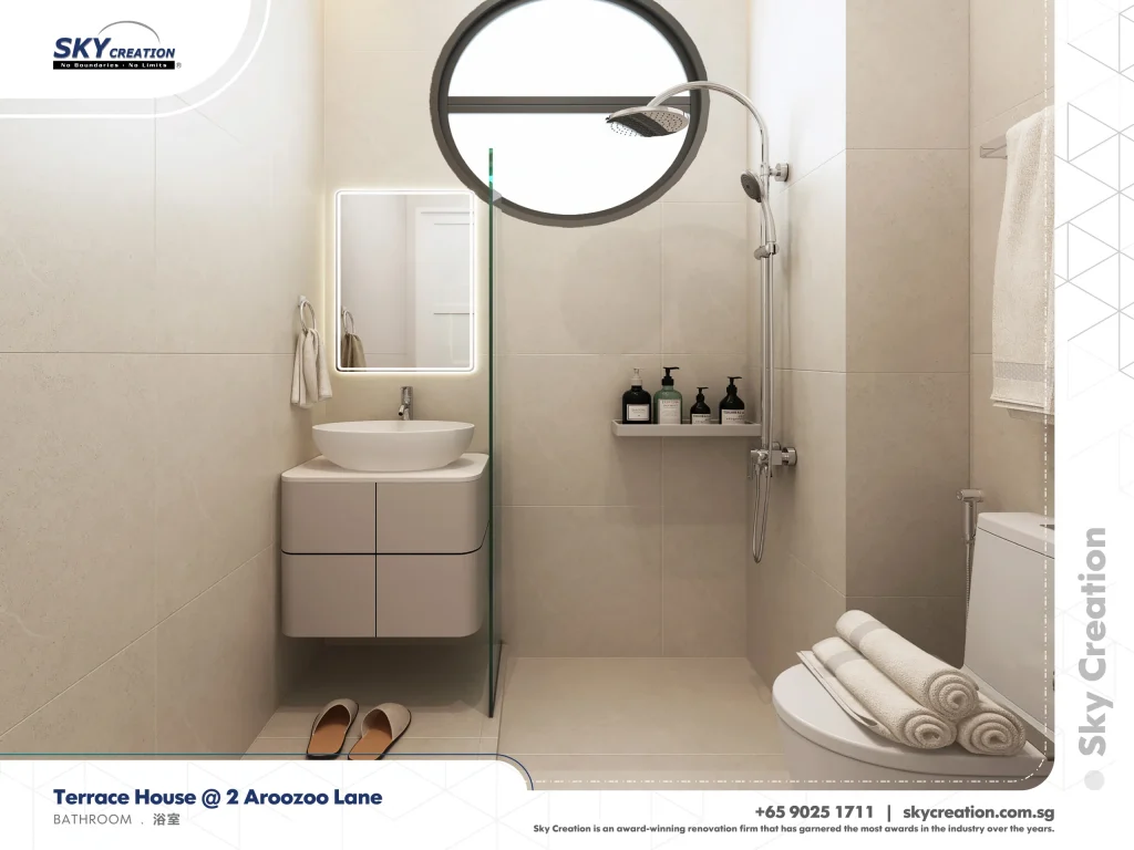 Aroozoo Lane bathroom with a round window above the shower and a compact floating vanity