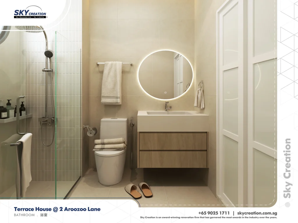 Aroozoo Lane bathroom with a round illuminated mirror and glass shower screen