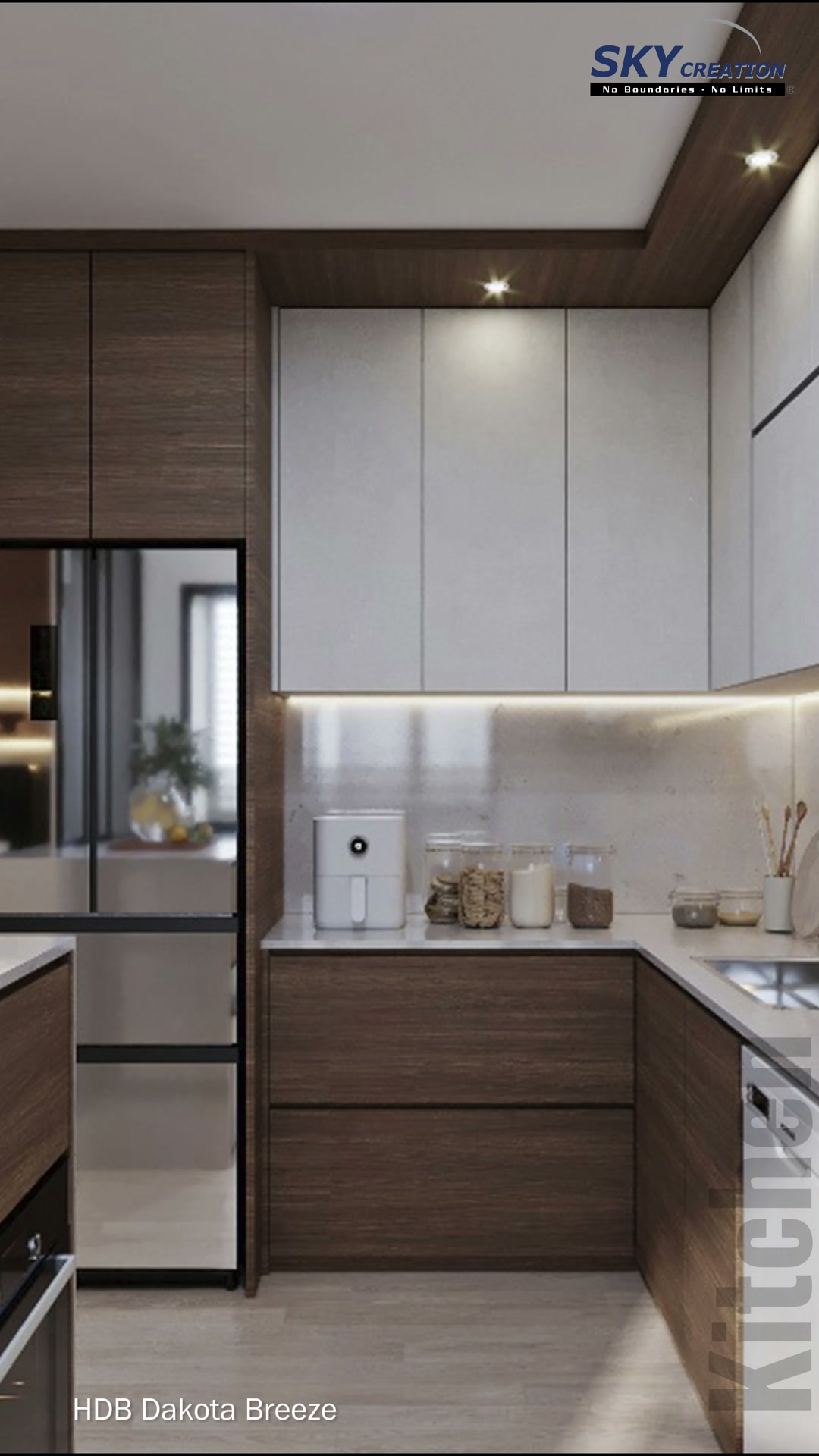 Dakota Breeze kitchen view with dark timber lower cabinets, pale upper cabinets and a refrigerator