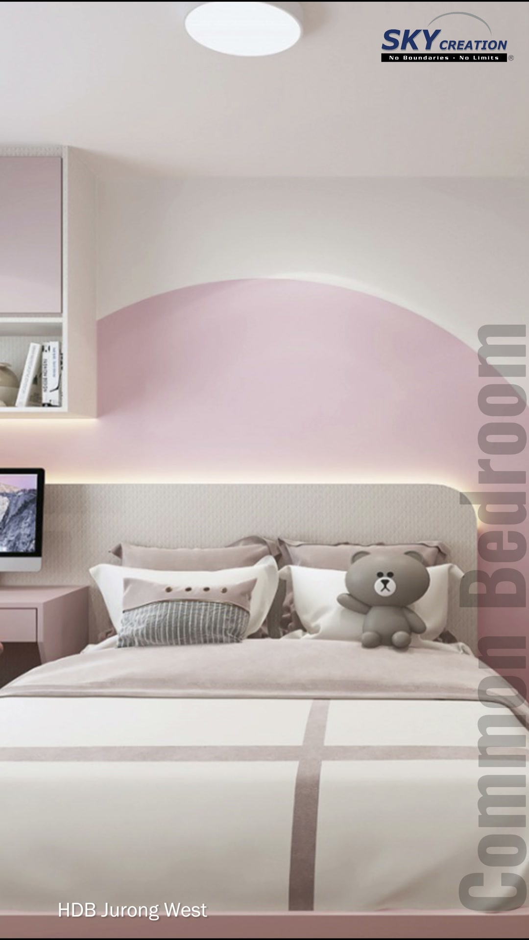 Jurong West bedroom with a curved pink wall behind the bed and pale study cabinetry