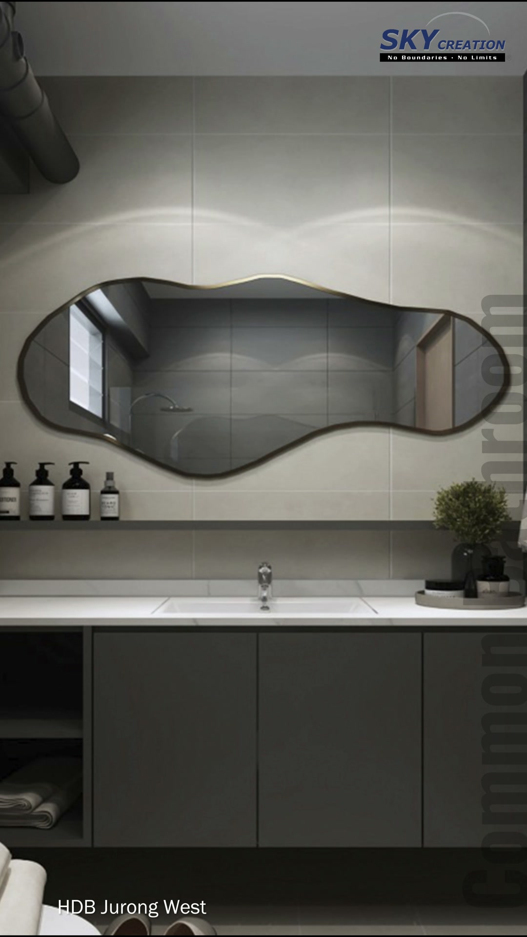 Jurong West bathroom with an irregular mirror, grey vanity and exposed black pipe