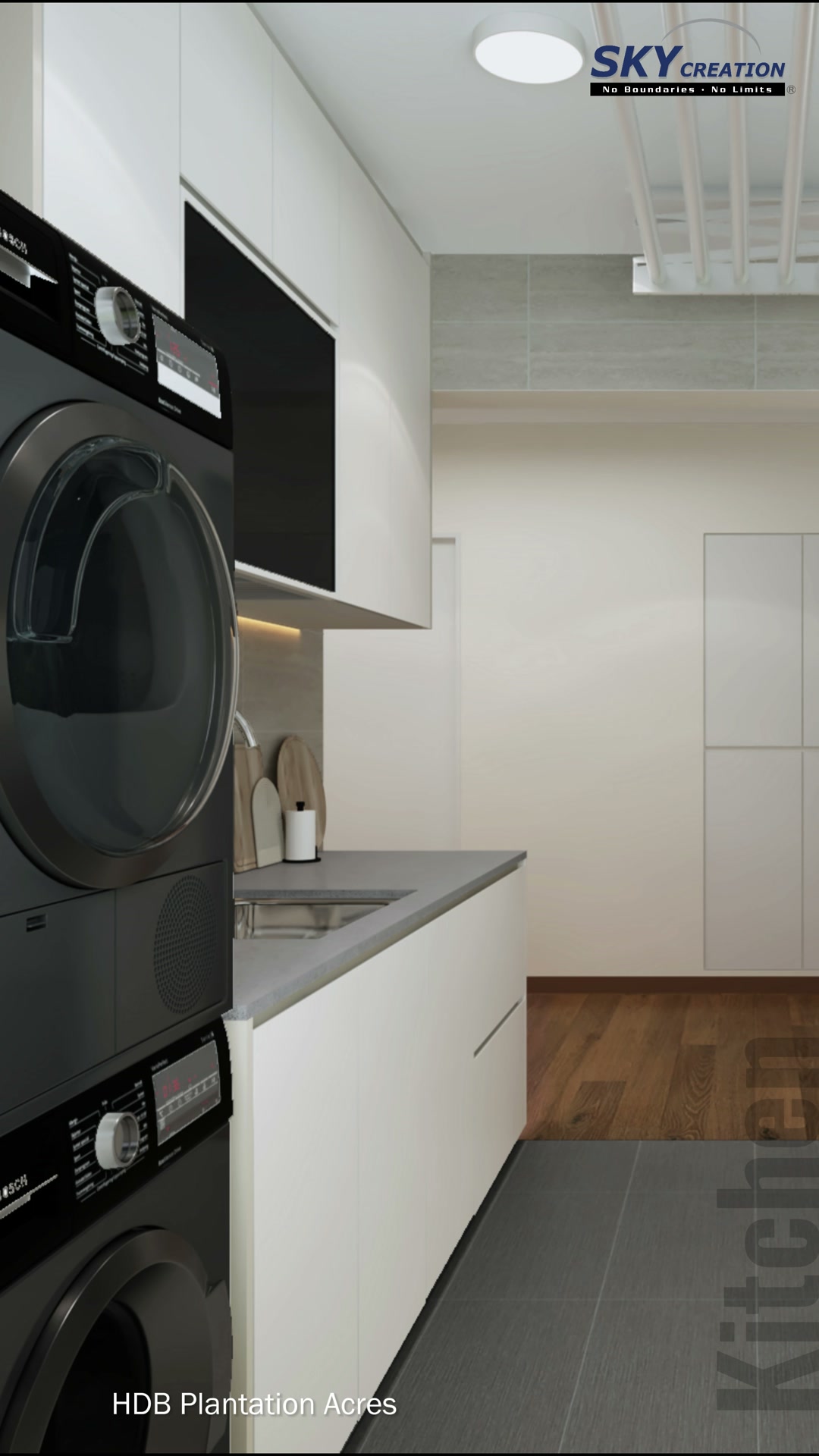 Plantation Acres laundry area with stacked dark appliances and pale tall storage