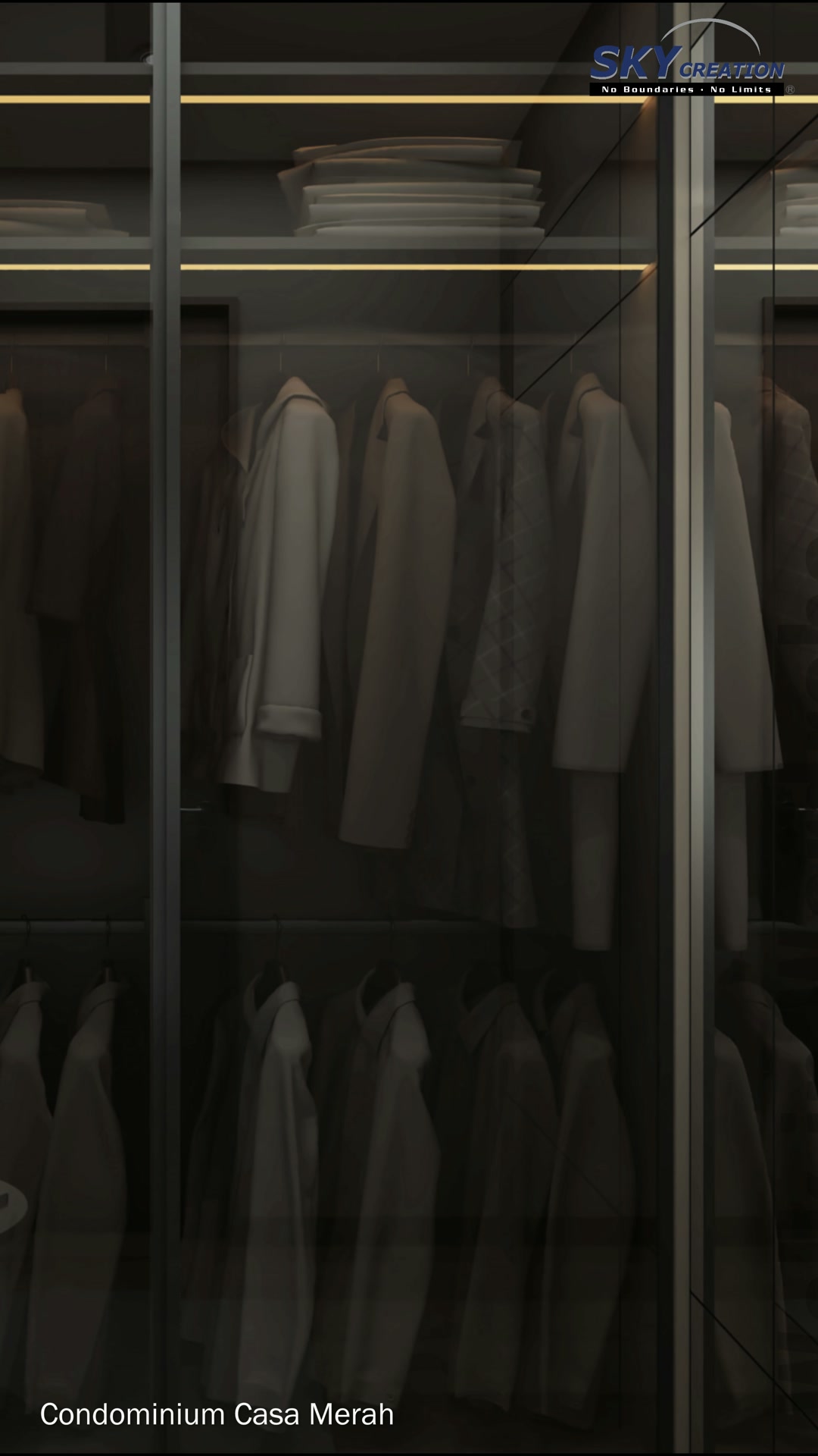 Casa Merah dark glass wardrobe with amber-lit shelves and organised hanging storage