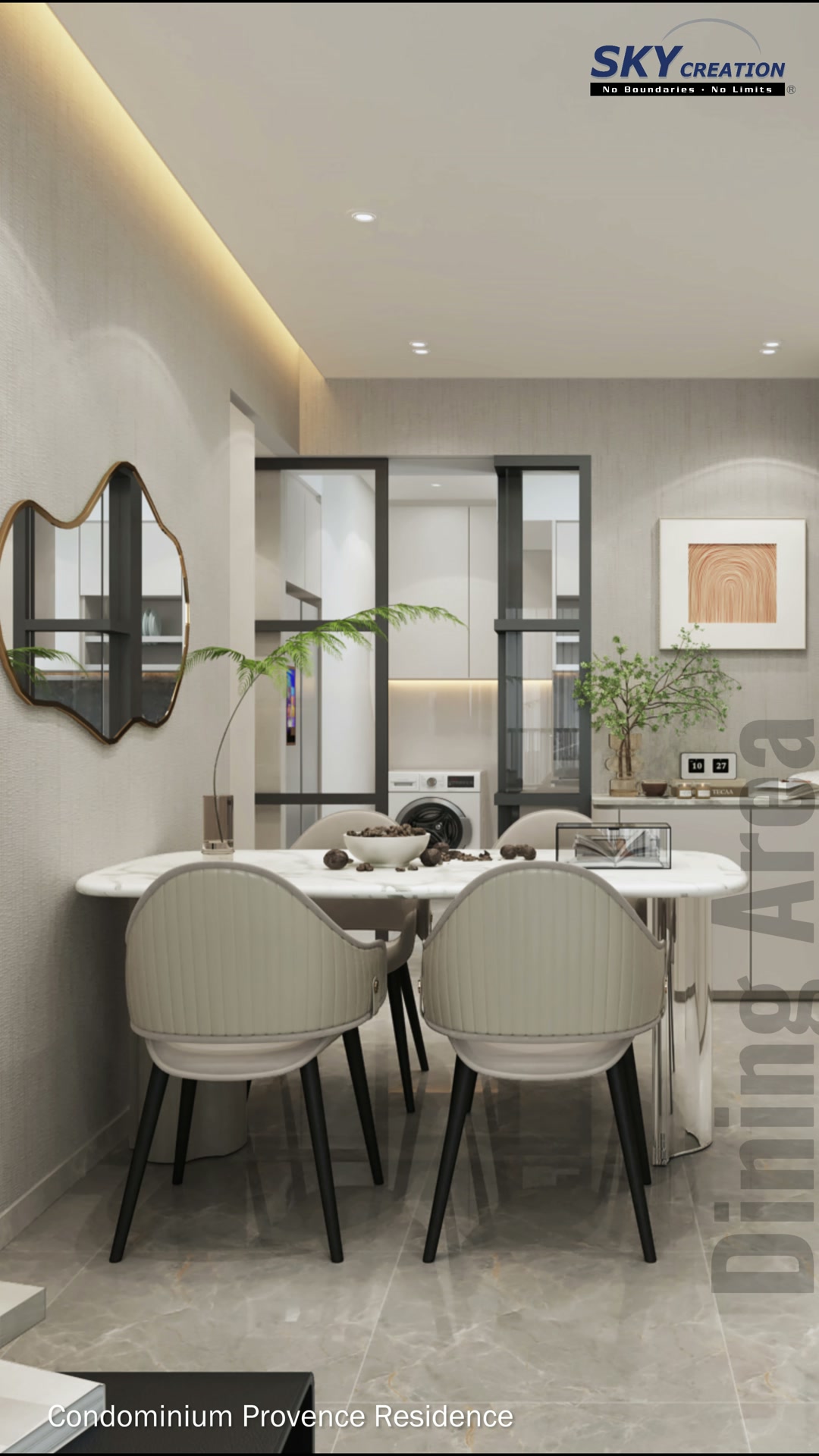 Provence Residences dining area with a rounded table, pale chairs and sculptural wall mirror