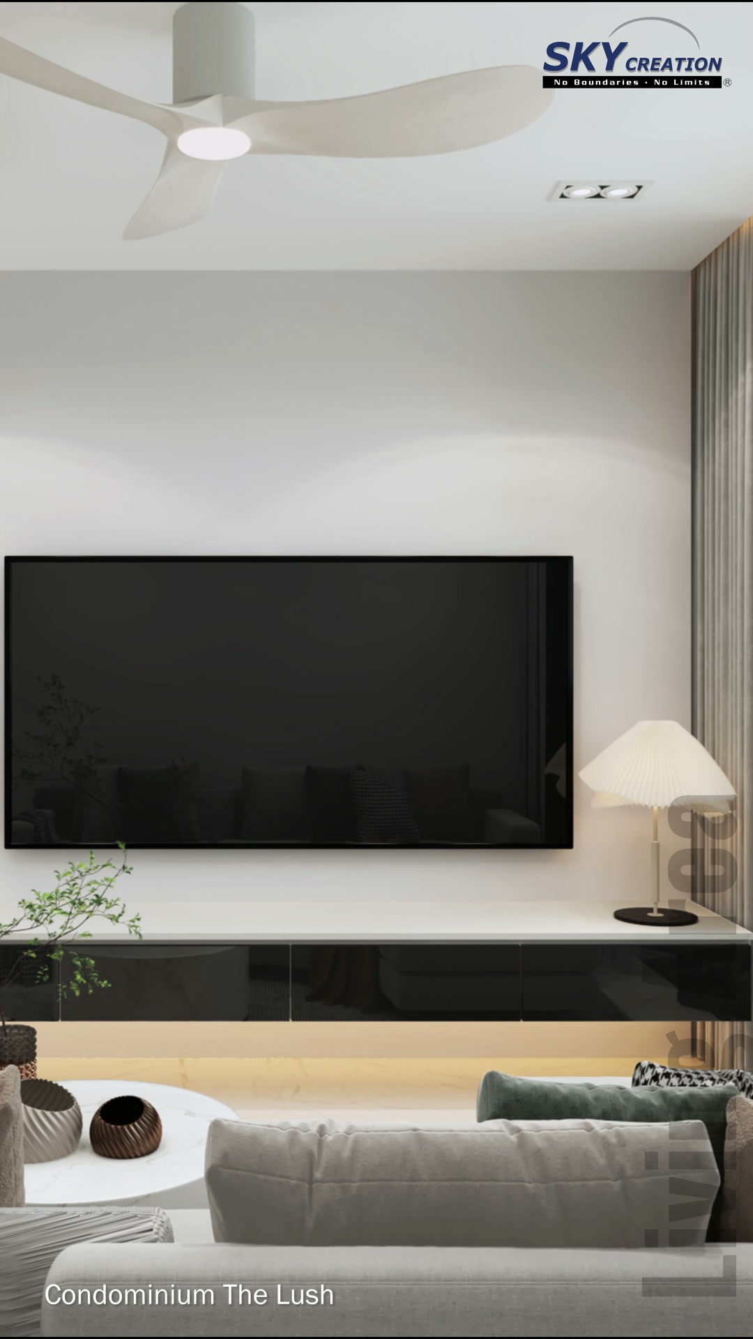 The Lush living room with curved sofa, wall-mounted television and slim low console