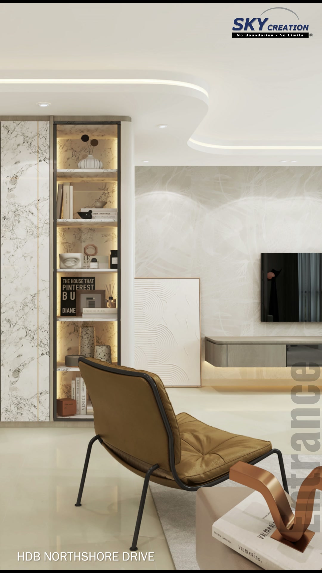 Northshore Drive living area with marble-look storage wall, warm display niche, brown chair and floating television console