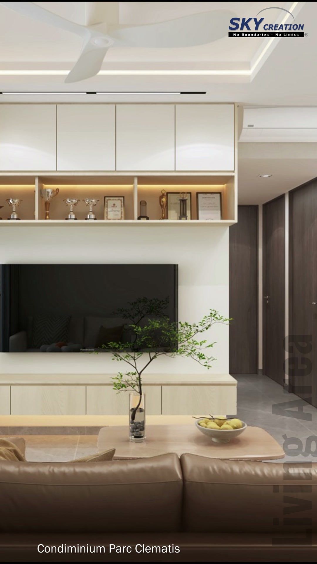 Parc Clematis television wall with continuous upper cabinetry and an open trophy shelf