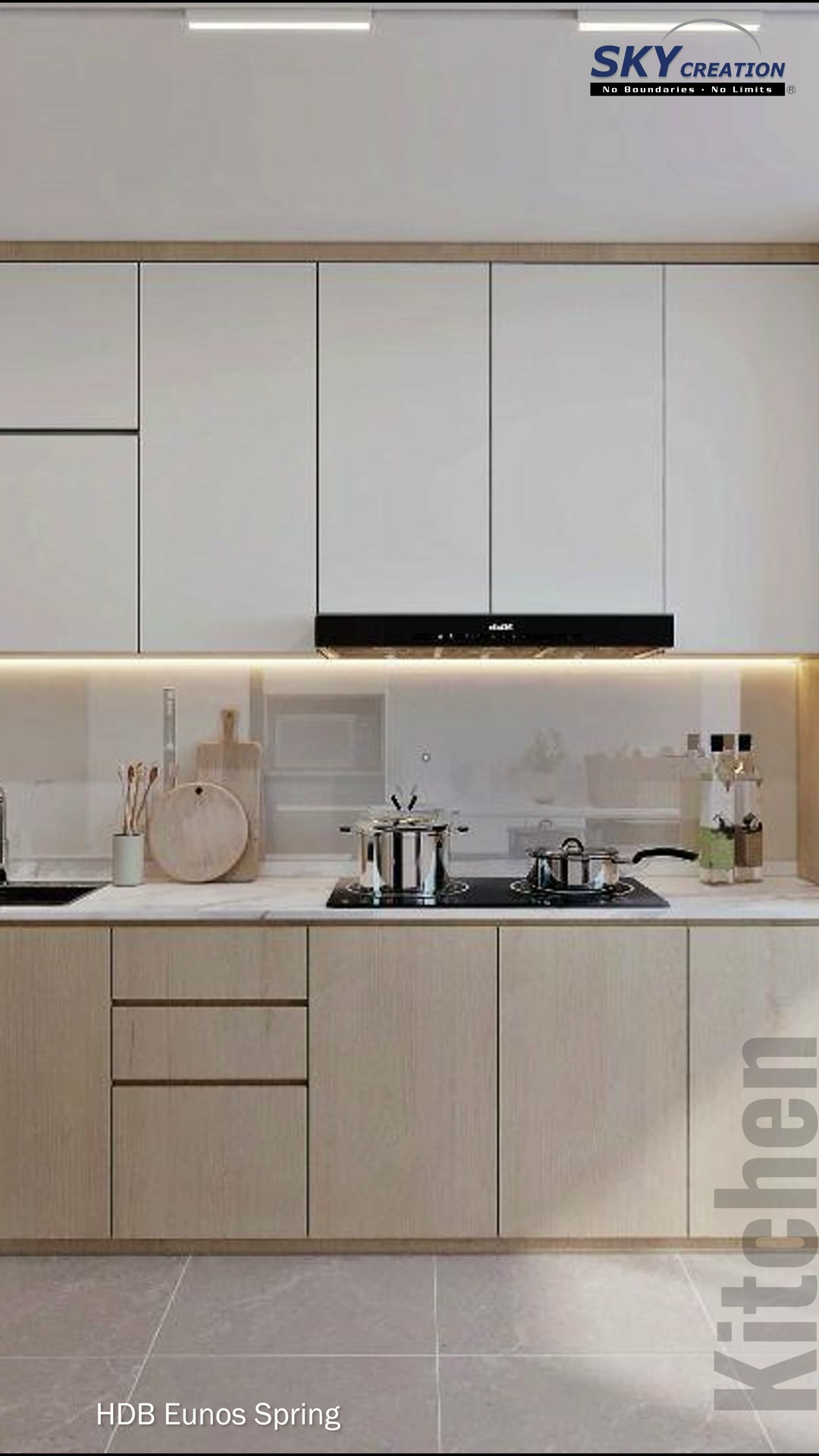 Eunos Spring compact kitchen with warm-white cabinetry and concealed lighting