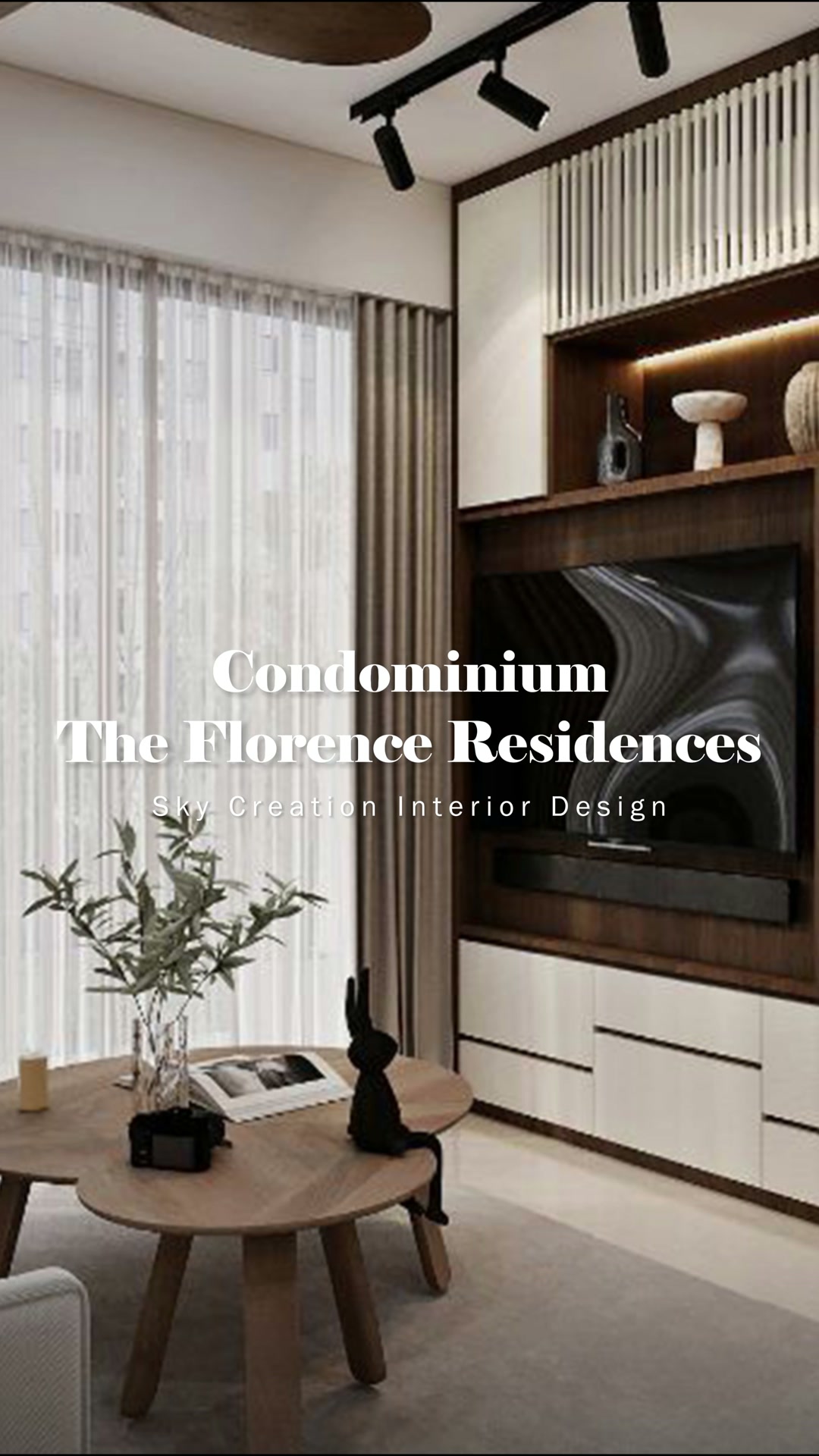 Florence Residences living room with a walnut-framed television wall and white cabinetry