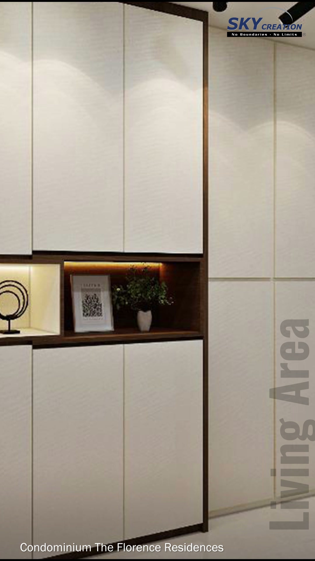 Florence Residences entrance cabinetry framed in walnut beside a mirrored return