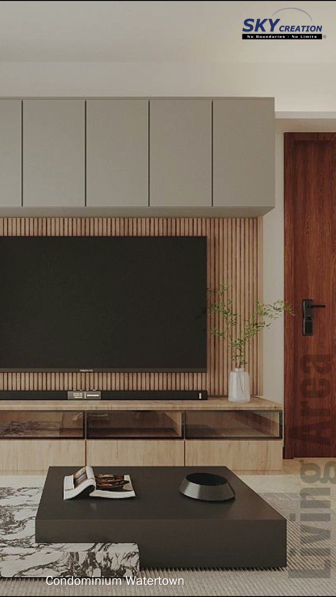 Watertown living area with a tower speaker, black coffee table and asymmetric rug