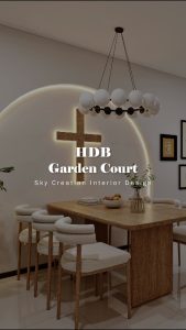 Original HDB Garden Court 3D cover showing the warm timber dining table, curved illuminated wall feature and upholstered chairs