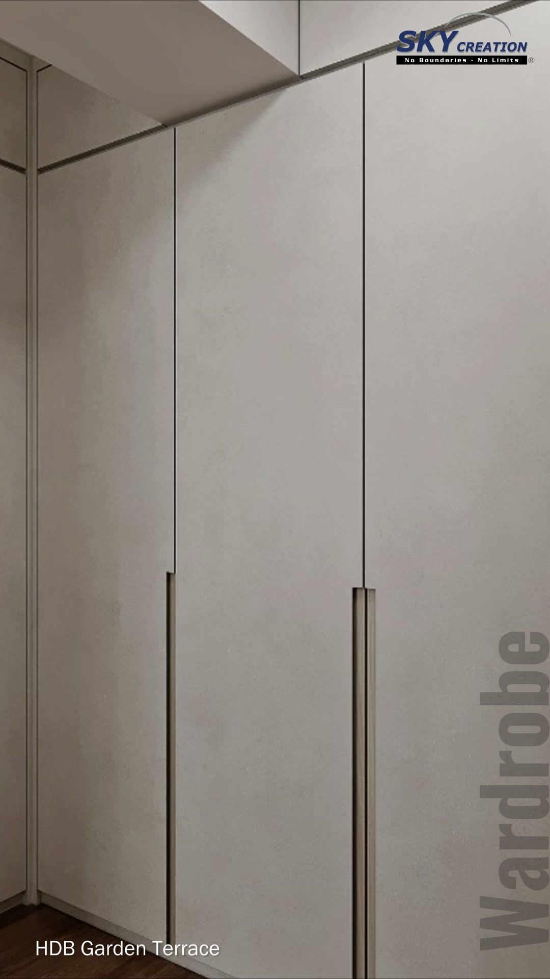 Garden Terrace wardrobe with pale full-height doors, slim dark handles and a warm display bay
