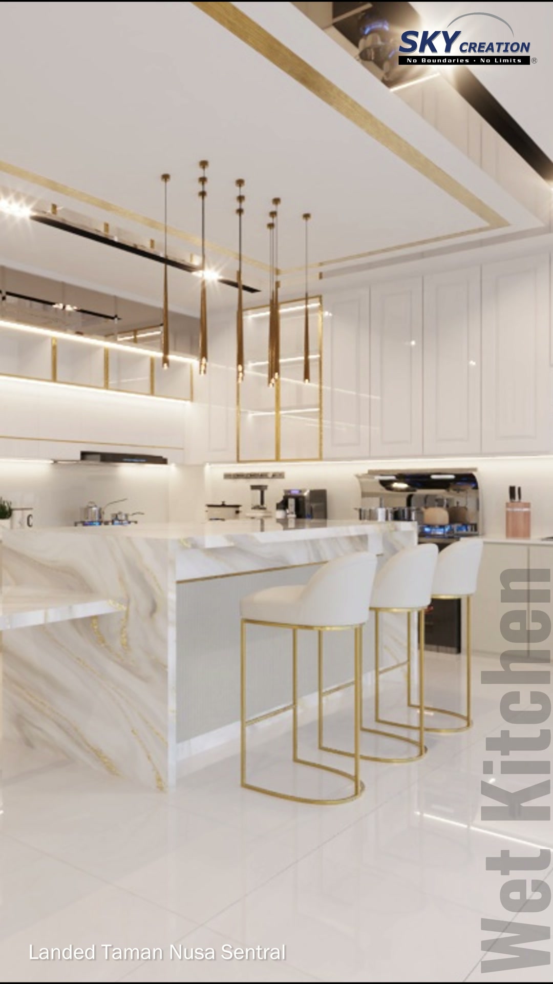 Taman Nusa Sentral dry kitchen with illuminated shelves, a pale counter and gold-framed seating