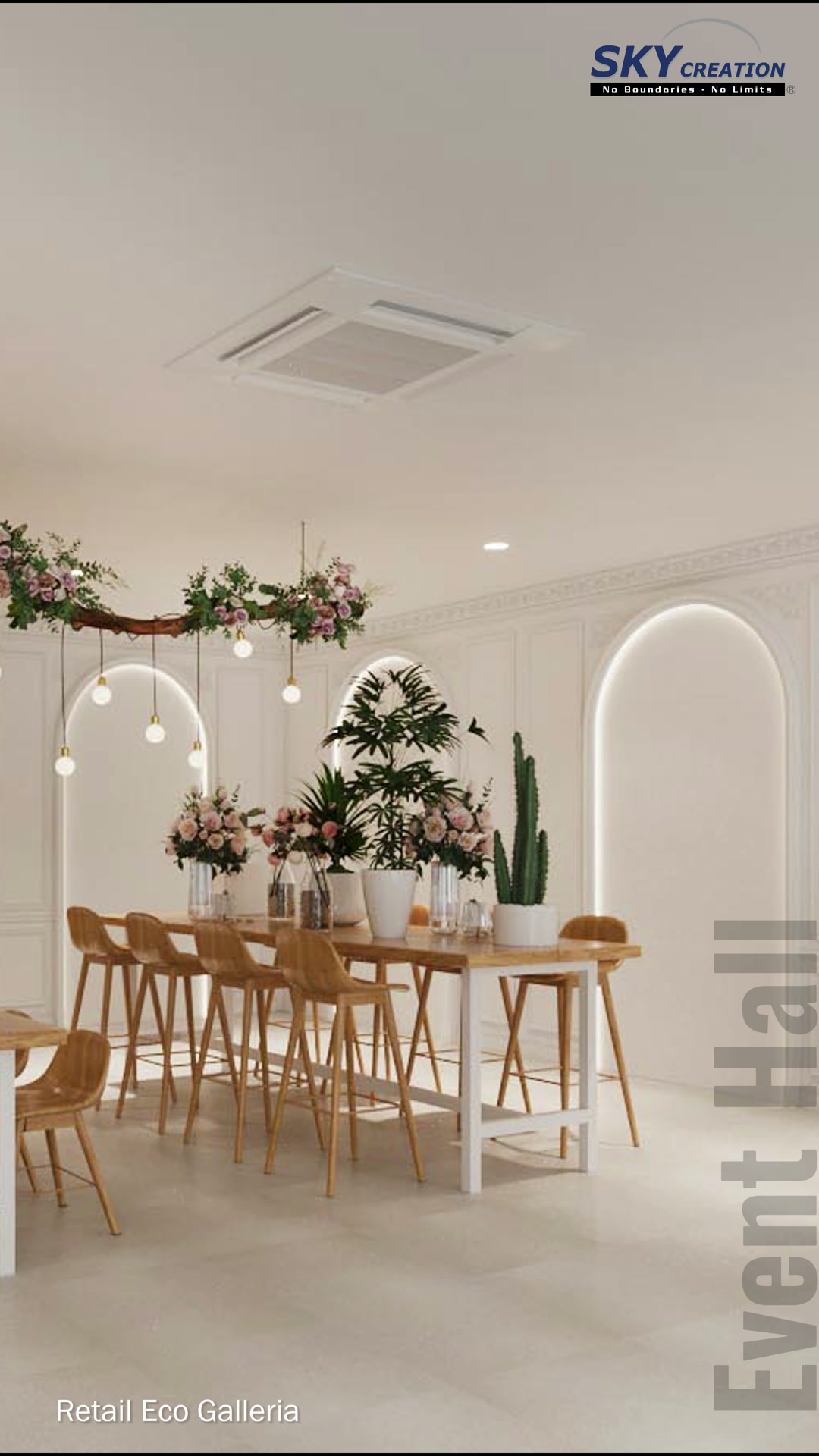 Wide Eco Galleria event hall view with a central floral table, warm timber seating and framed ivory walls