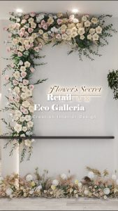 Eco Galleria floral arch retail concept with a full-height flower installation and textured feature wall