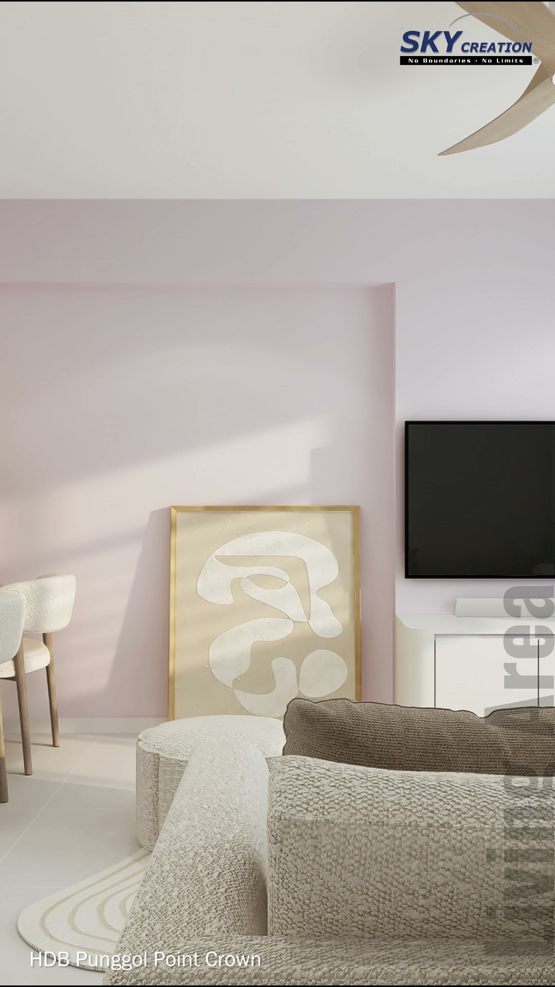 Punggol Point Crown living area with a soft blush feature wall and pale cabinetry