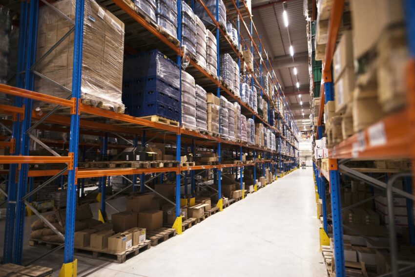 interior large distribution warehouse with shelves stacked with palettes goods ready market 1
