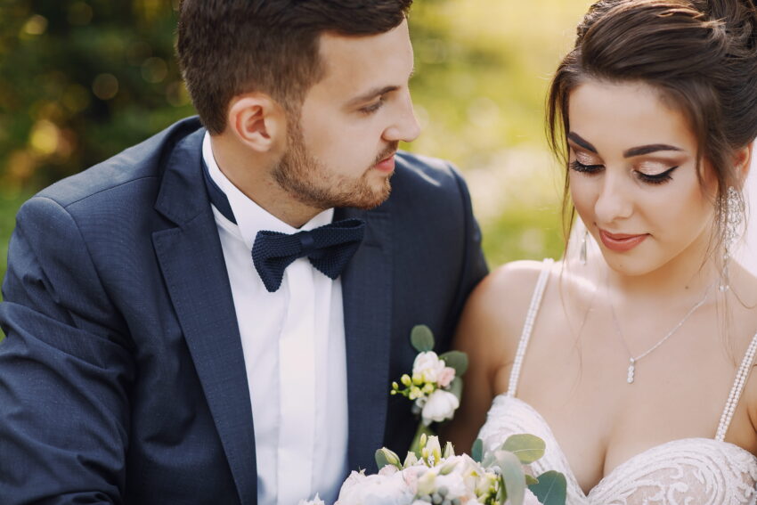 young beautiful bride her husband standing park with bouquet flowers 1
