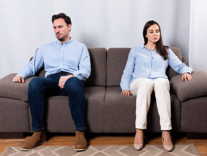angry male woman sitting couch 2 1
