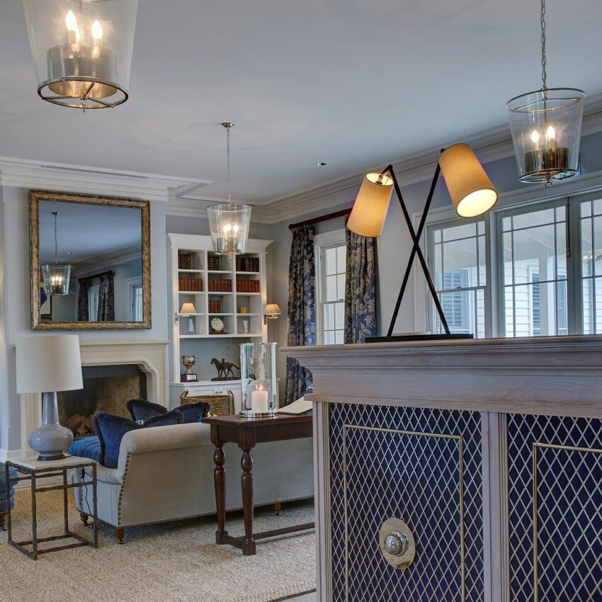 Refined Living Room Interior with Hidden Television and Classic Architectural Detailing