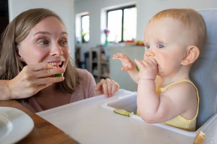 imgi 4 happy excited mom training baby bite solid food eating watermelon together