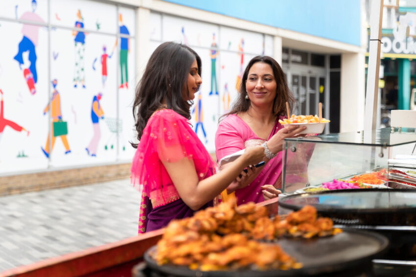 side view women buying food 1