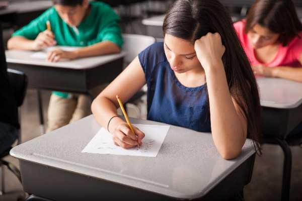 group high school students taking test classroom 2