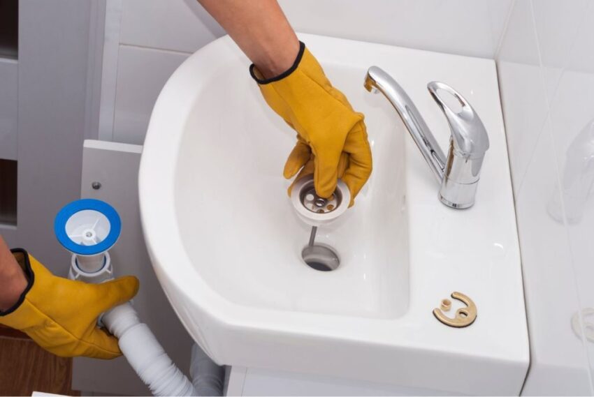 Plumber replacing drain in bathroom sink 1024x686 1