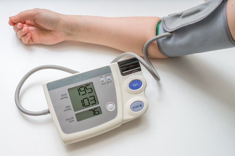hypertension concept man measuring blood pressure monitor white background 73745697